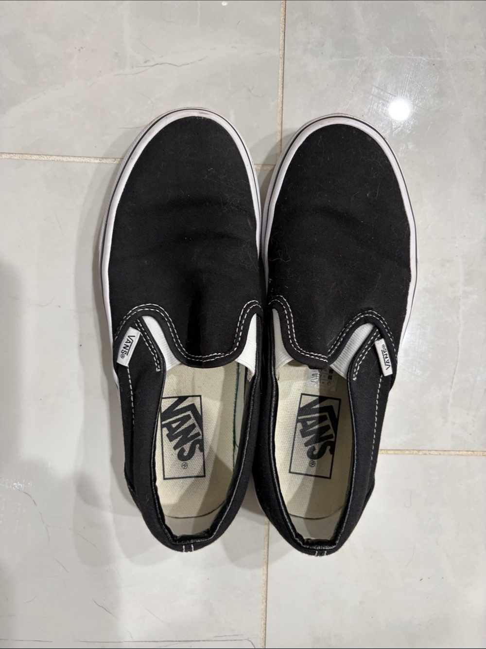 Vans Black and White Canvas Slip-On Sneakers
